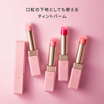 Cle de Peau Beaute Magnifique Le Rouge n Moisturizing Lip Balm Radiant Background