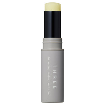 THREE Balancing Protective Lip Bar SPF20 PA++ Visual Protection Background