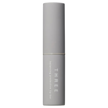 THREE Balancing Protective Lip Bar SPF20 PA++ Visual Protection Background