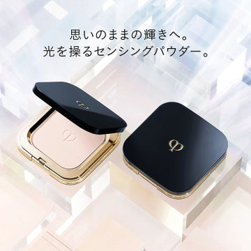Cle de Peau Beaute Poodle Compact Essence Air Radiant Diamond Treatment Powder White Background