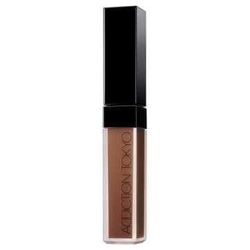 ADDICTION Skin Reflect Fix Concealer - Skin Reflect Fix Concealer / 015 Deep Almond / 6.5mL product bottle on white background