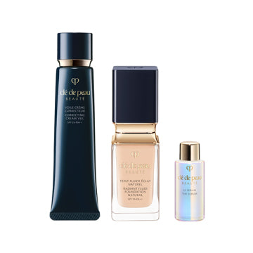 Cle de Peau Beaute Tan Fluid Eclat Natural - Pre-makeup & Foundation Kit (Tan Fluid Eclat Natural Ochre 00) / 40g, 35mL, 7mL product bottle on white background