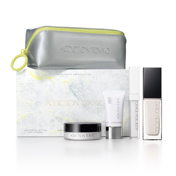 ADDICTION The Foundation Lift Glow - Holiday The Foundation Lift Glow Kit / 000 Porcelain / 2.5g, 15g, 4g, container only, 30mL product bottle on white background