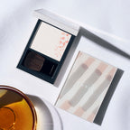 THREE Sacred Space Face Powder Radiant Glow White Background
