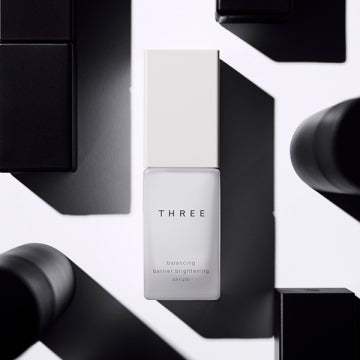 THREE Balancing Barrier Brightening Serum Radiant Skin Background