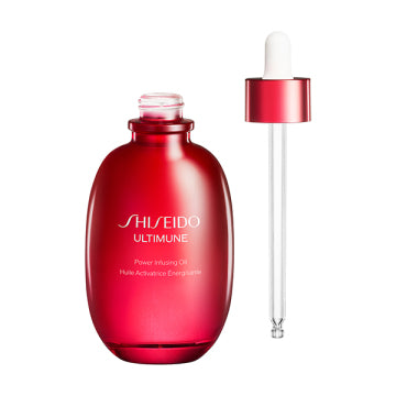 SHISEIDO Energizing Oil Revitalizing Skincare Product Green Floral Background