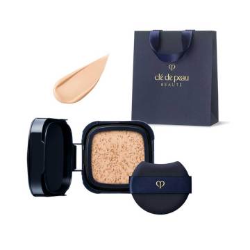 Cle de Peau Beaute Case (Cushion Eclat Lumine) - Tan Cushion Eclat Lumine (refill only) Ochre 10 Limited Set / Ochre 10 / 15g, container only / Scented with natural rose oil and more product bottle on white background